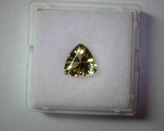 photo number one of Gold Beryl 3.47 Trilliant 11mm item 314